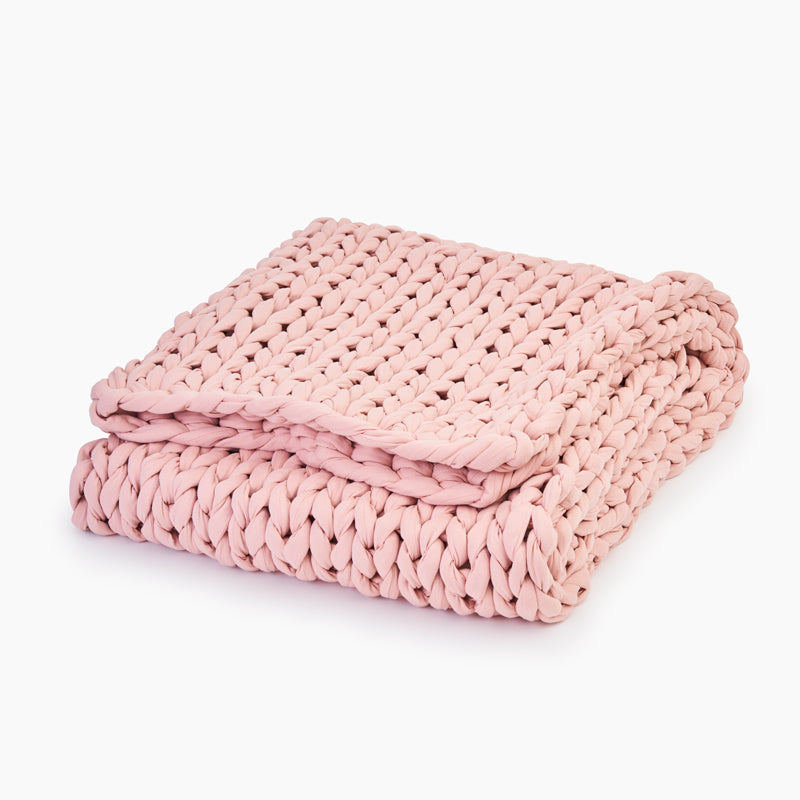 Folded evening rose colored cotton weighted blanket