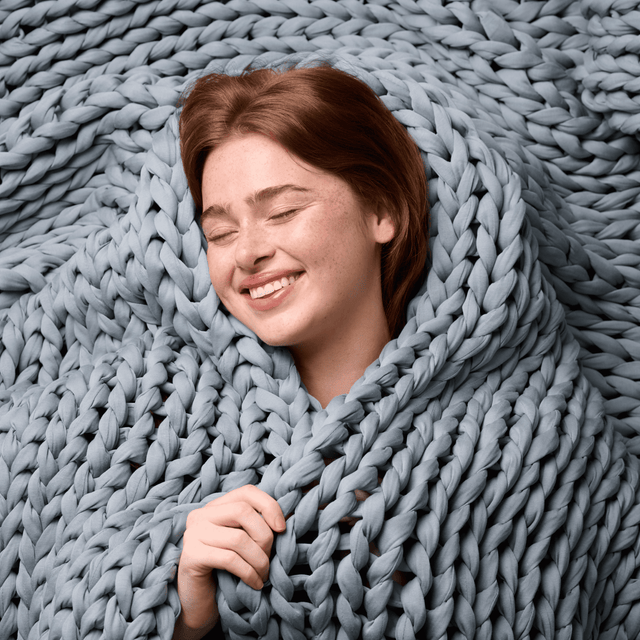 women wrapping with bearaby blue napper