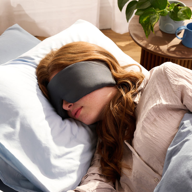 lady sleeping with weighted sleep mask