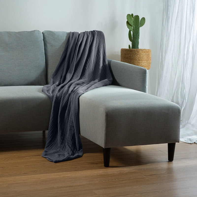 muslin blanket for adults on couch