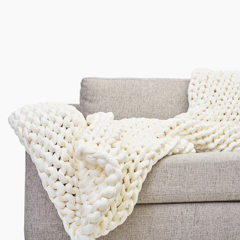 bearaby open knit weighted blanket on sofa