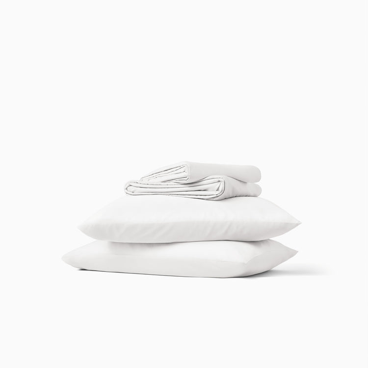 Stack of white pillows on a white background