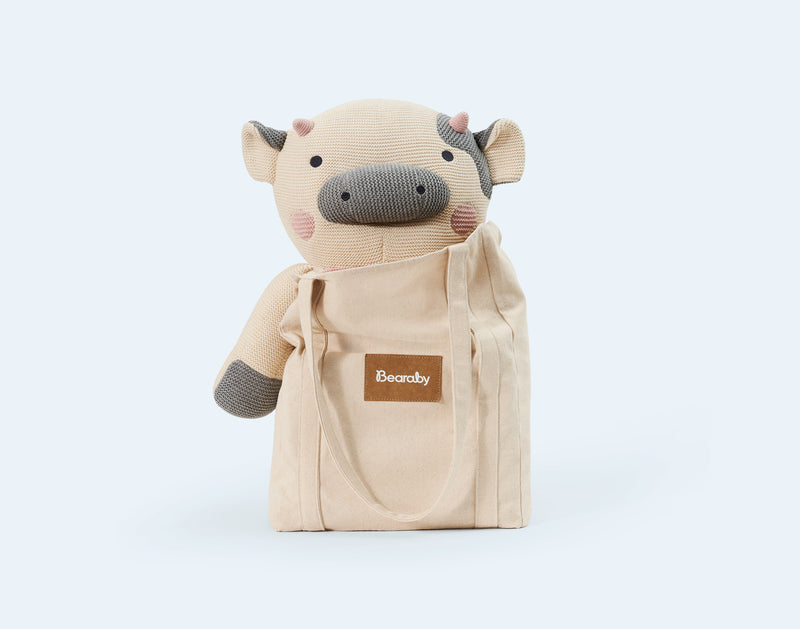 weighted stuffed cow with bag