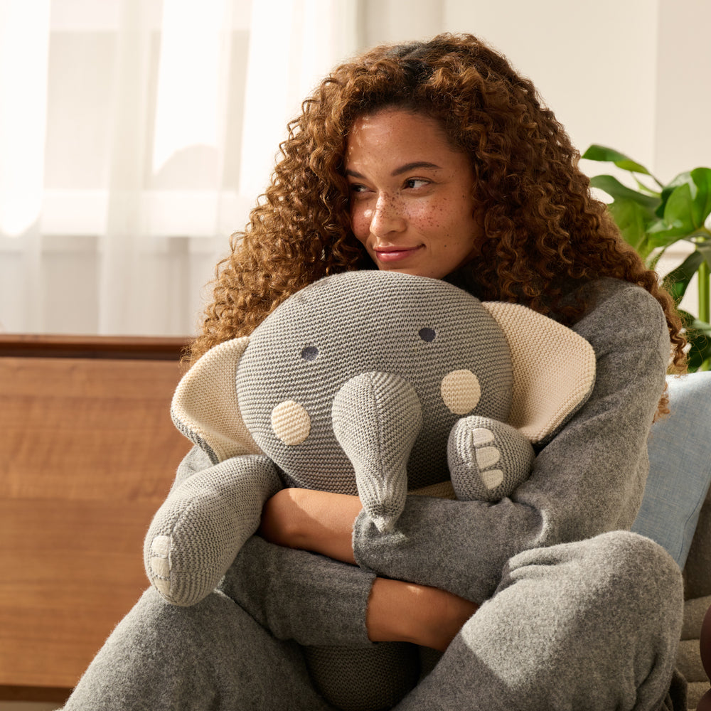 cuddling with bearaby weighted elephant