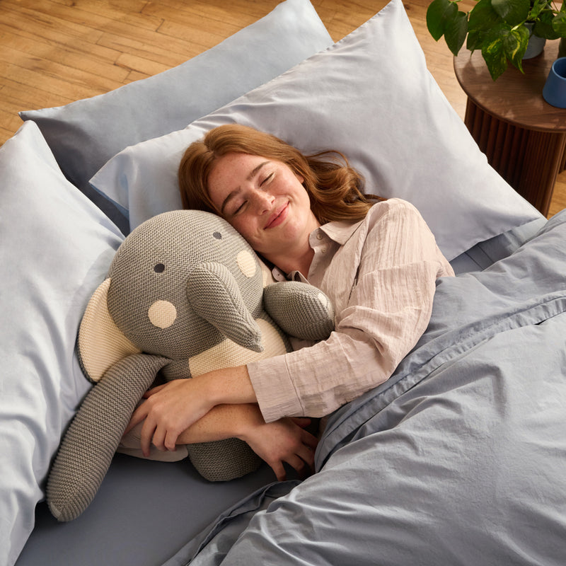 women resting with Bearaby Elli plushies