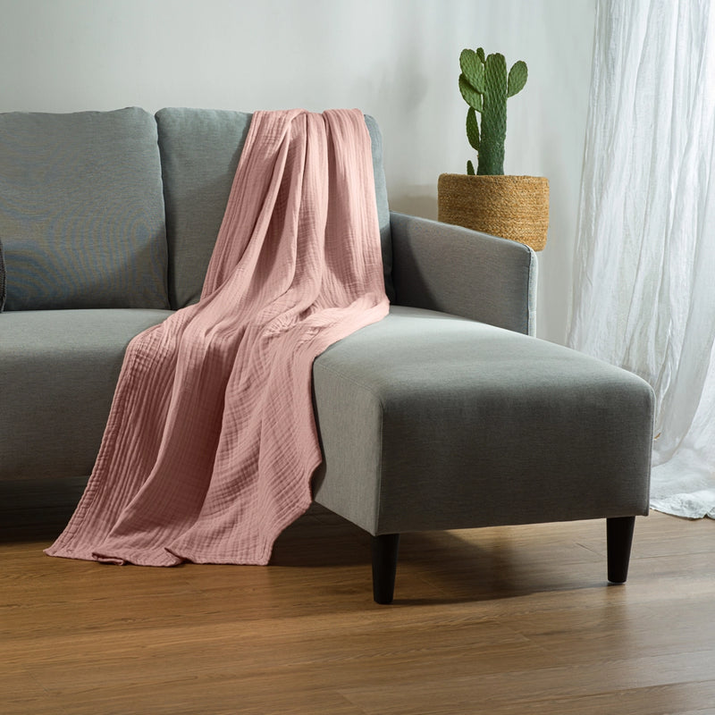 pink bearaby throw blanket on couch