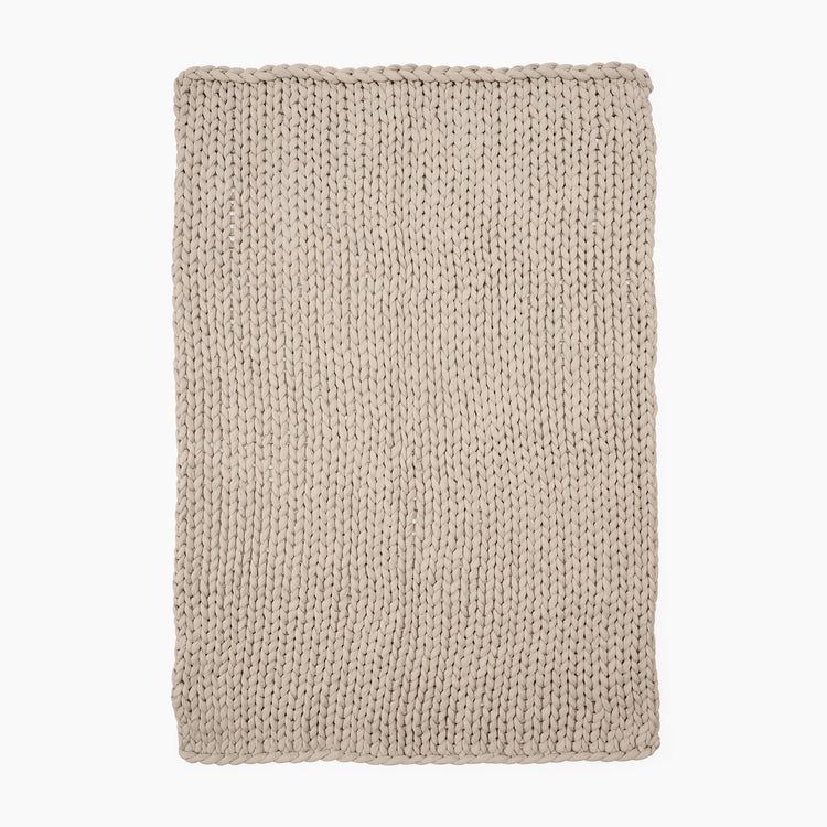Full Image of beige knitted ocean blanket
