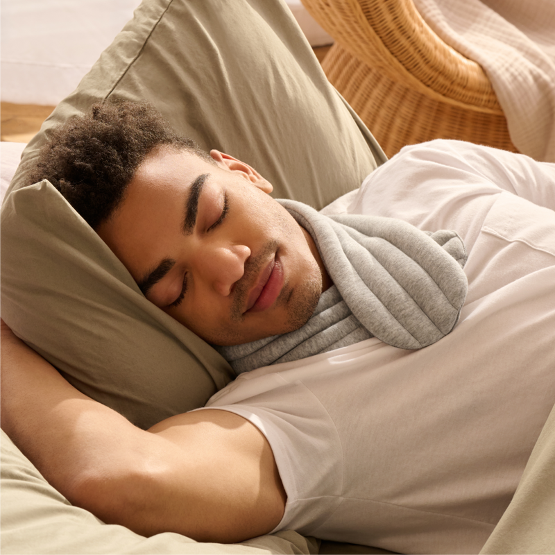 a person sleeping with bearaby neck wrap