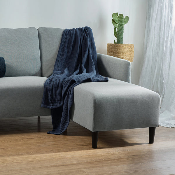 midnight blue muslin throw blanket on couch 