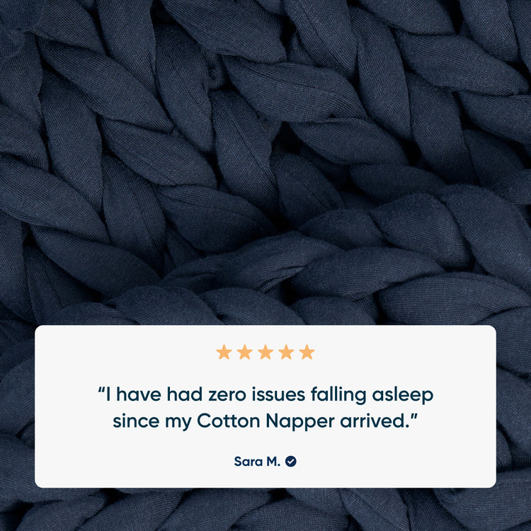 midnight blue cotton knitted blanket with a five-star rating text overlay