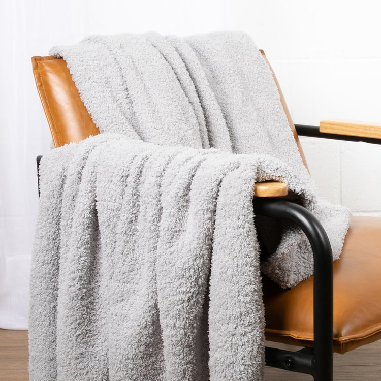 grey warm plush blanket on chair