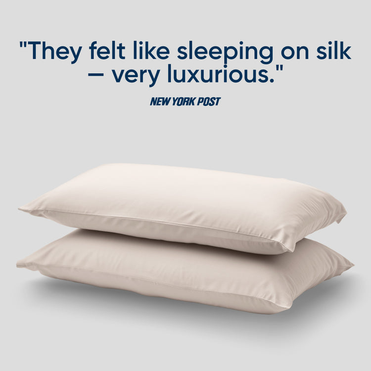 Two bearaby morning pearl colored pillowcase with a quote from The New York Post at the top.