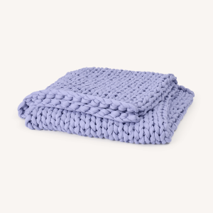 Close-up macro shot of YnM bamboo viscose cover weave and stitched pocket grid containing glass beads