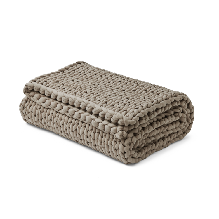 Folded softwood blanket on a white background